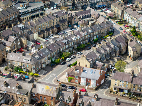 Aerial view above rows of back to back affluent town houses and  terraced houses