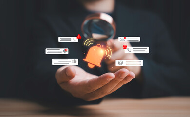 Obraz premium Businessman analyzing digital notifications with a magnifying glass, surrounded by alert, email, and communication icon for Concept of notification management, data monitoring, cybersecurity.