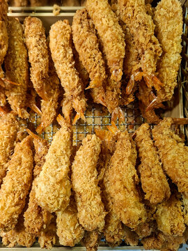 top-down view of a pile of golden-brown fried prawns