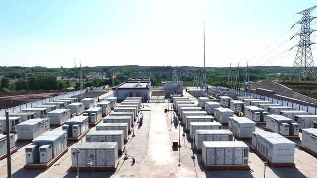 Large-scale energy storage power station with neatly arranged battery container arrays under clear sky