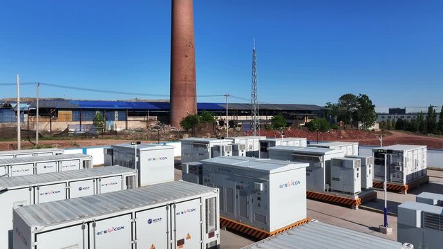 Industrial site featuring an array of energy storage battery container units