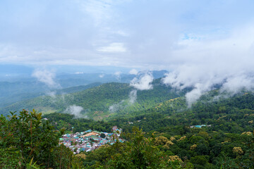 Obraz premium Doi pui hmong village mountain mist green forest landscape nature sky clouds peaceful Thailand