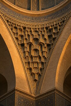 Architectural detail of a squinch supporting a dome with geometric patterns.