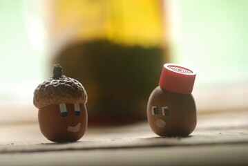 SERRAJA acorn with Diana acorn on a wooden background © oleg