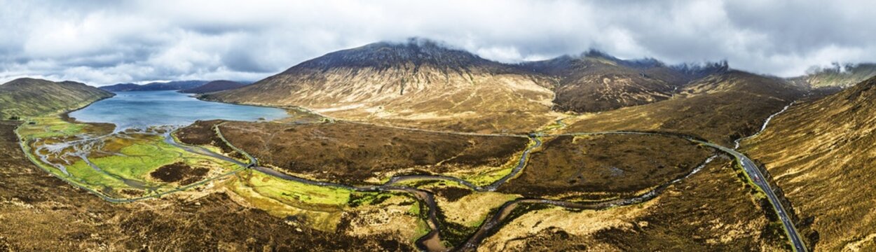 Panorama of Eas a' Bhradain Waterfall from drone, Red Cuillin mountains, Loch Ainort, Isle of Skye, Scotland, UK