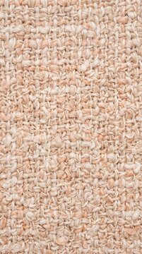 Soft woven fabric texture with neutral beige boucle yarn, close up of cozy looped weave pattern conveying warmth and tactile comfort
