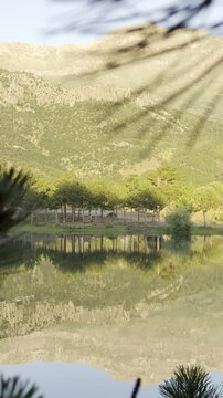 Captivating Alpine Scenery: Glassy Lake Reflections and Majestic Mountain Landscapes