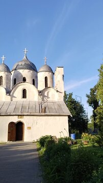 Cathedral of Ioann Predtecha (John the Precursor). Pskov. Russia. ancient Russian Orthodox architecture. green garden. Historic stone church exterior. scenic backyard landscape footage