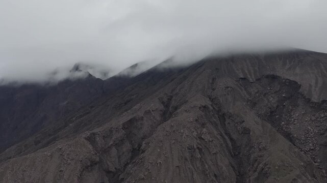 Aerial view of rugged slope and fog on summit of Sakurajima volcano in Kagoshima, Japan