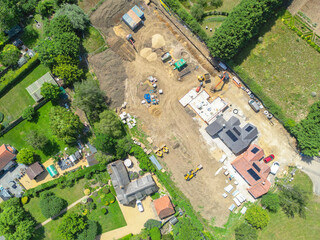 Interesting drone UAV view of a new detached bungalows being built within a small building plot in Cambridgeshire, UK. Established homes surround the site. © Nick Beer