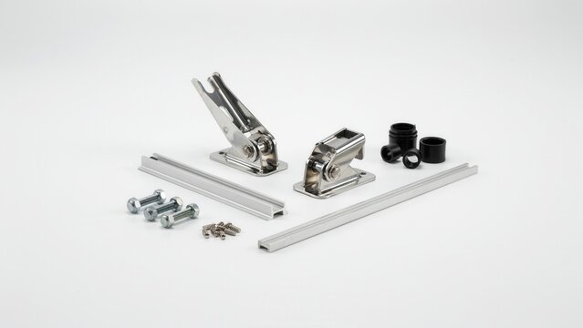 Hardware components including metal brackets and fasteners are organized on a clean white surface for assembly.