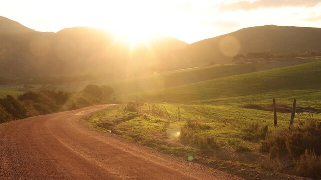 rural dirt road and field at sunrise, Stanford, South Africa