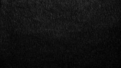 Fototapeta premium black cotton fabric texture reveals organic woven pattern in minimalist moody lighting