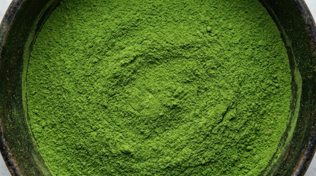 Top view of vibrant green matcha tea powder texture