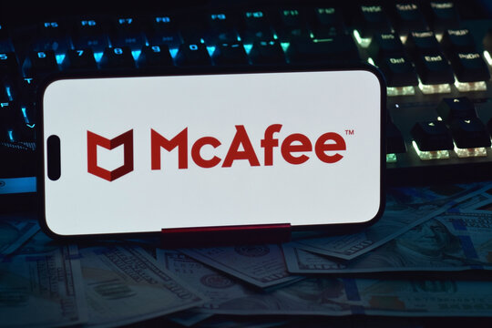 On a mobile phone screen logo McAfee Corp global computer security software company.