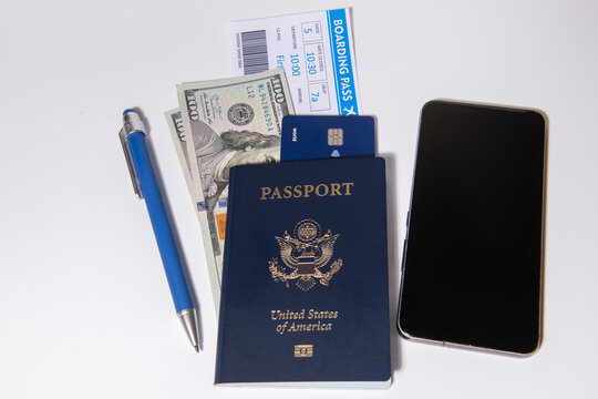US passport with boarding pass. American passport with cash and credit. Travel and money for trip. American passport and airline tickets with US dollars for travel. Passport boarding pass for travel.