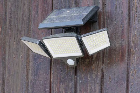 Solar powered led light with motion sensor on wall