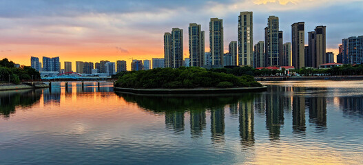 Waterfront City Skyline at Sunset © LuuDieuThanh