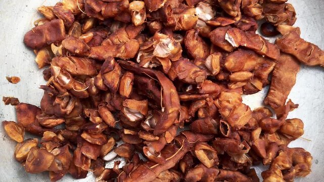Top View of Seedless Tamarind Heap or Imli Stack in Sunlight for Drying
