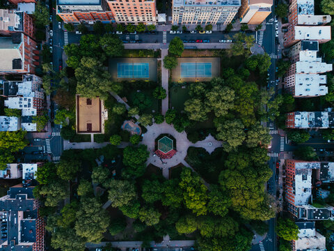 Aerial View of Urban Park With Tennis Courts
