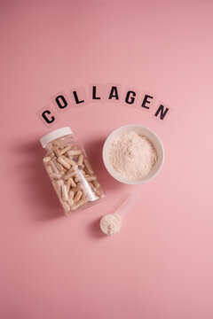 Collagen capsules in a bottle and powder in heart shaped dish with collagen lettering