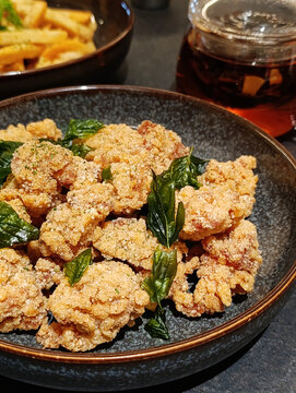 Taiwanese Popcorn Chicken Crispy Fried Chicken with Basil in a Ceramic Bowl