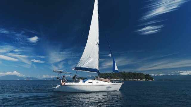Aerial view of the sailing boat sailing in the sea near the islands close to the town of Paraty and Angra dos Reis in Brazil