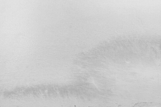Textured gray background with a subtle wave pattern and smooth finish