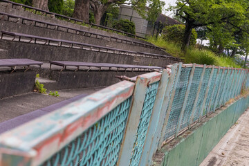 Empty spectator stands beside baseball field © sasaki ense
