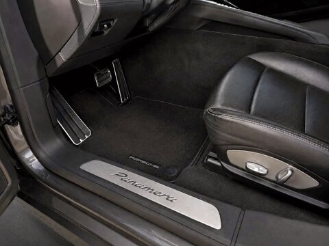 Porsche Panamera luxury car interior with floor mat and pedals