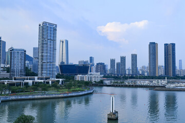 Modern waterfront skyline with marina and high-rise towers © PhungBao