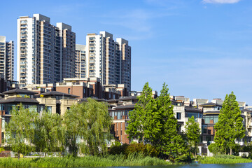 Modern waterfront residential community with high rise apartment towers and villas © PhungBao