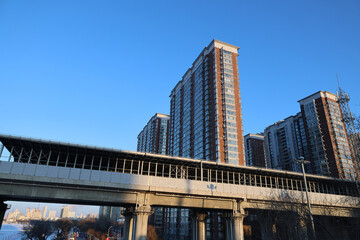 Elevated Rail Line and Modern Residential Towers in Urban Cityscape © PhungBao