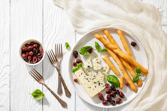 Gourmet blue cheese and breadsticks with olives