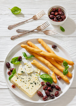 Premium blue cheese plate with grissini and olives