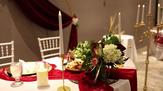 Elegant wedding reception table with candles and flowers