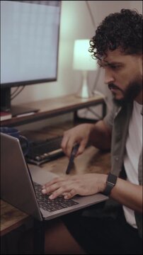 Young businessman working remotely from home office
