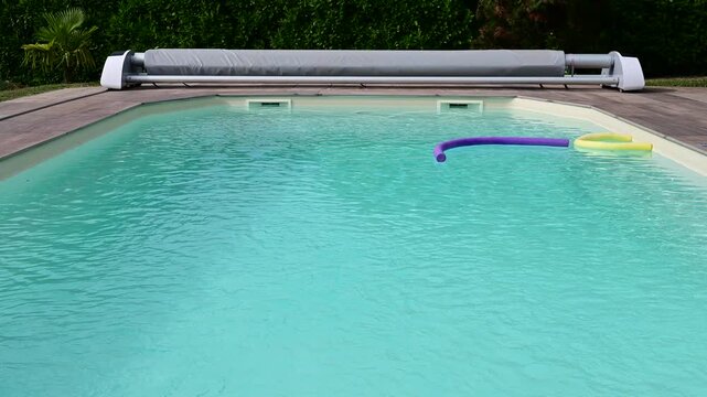 A swimming pool in France during a heatwave and the hottest day recorded in the country.
