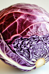Obraz premium A detailed view of a purple cabbage on a white background vertical frame