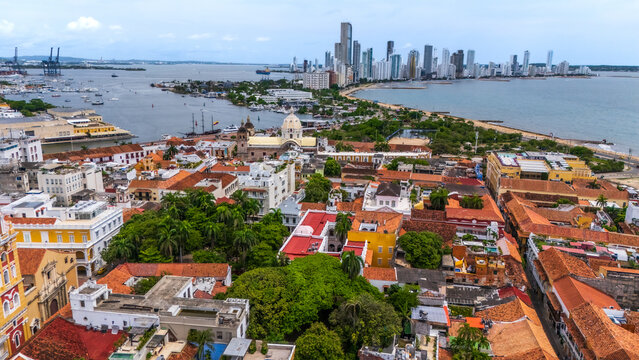 Drone view looking down at the famous Clock Tower (Torre del Reloj), the historic main gateway to the old walled city of Cartagena, Colombia.