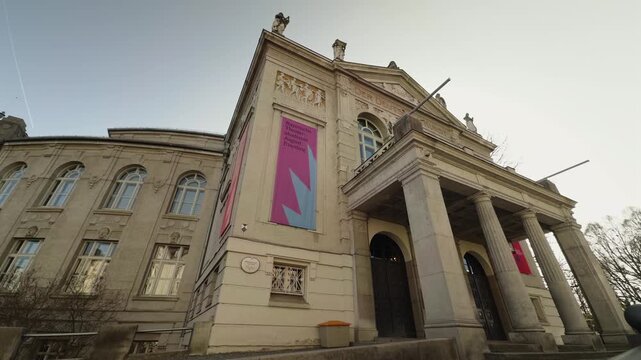 Wide shot of the freestanding Prinzregententheater at Bogenhausen in Munich Germany, showcasing neoclassical columns outside and a legendary festival concert hall inside.