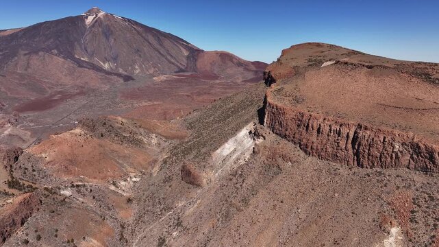Aerial drone flight along Mount Guajara ridge with Mount Teide in the background, Tenerife, Canary Islands