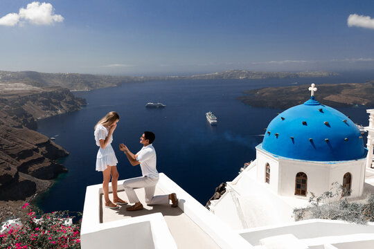 Propose in Santorini island with Blue domes and Volcano view Cruise shipos and caldera