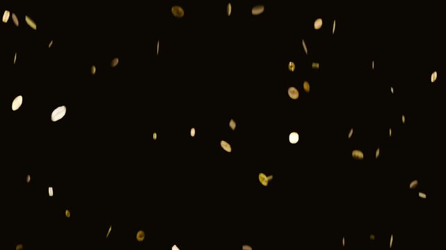 Tossing by offscreen hand metal discs, flakes spinning and falling at black set, making shimmer
