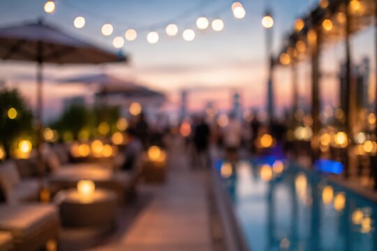 Blurred rooftop bar poolside lounge sunset city skyline bokeh string lights outdoor party social event evening atmosphere luxury lifestyle