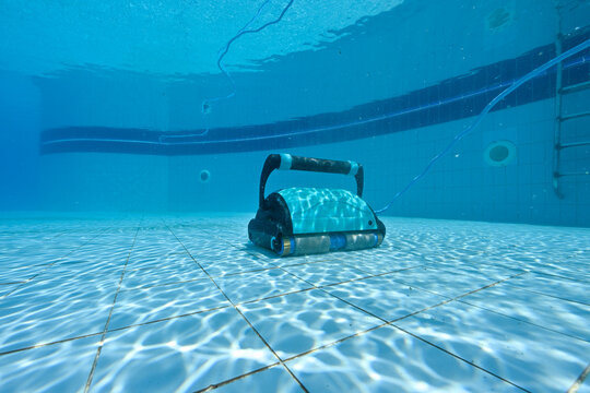 Submersible robot with cable cleaning the walls and floor of the pool  
