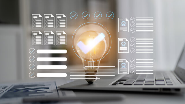 This image showcases a modern workspace where a light bulb represents innovative ideas, surrounded by documentation and check marks, illustrating productivity and efficiency in business. Gantry