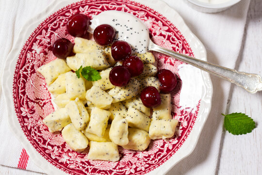 Lazy Vanilla Dumplings with Poppy Seeds, Sour Cream and Cherry Sauce