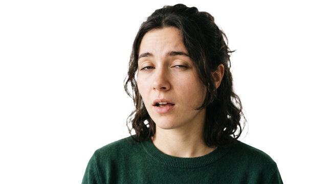 Young woman with eyes rolled back and mouth slightly open looking bored or tired