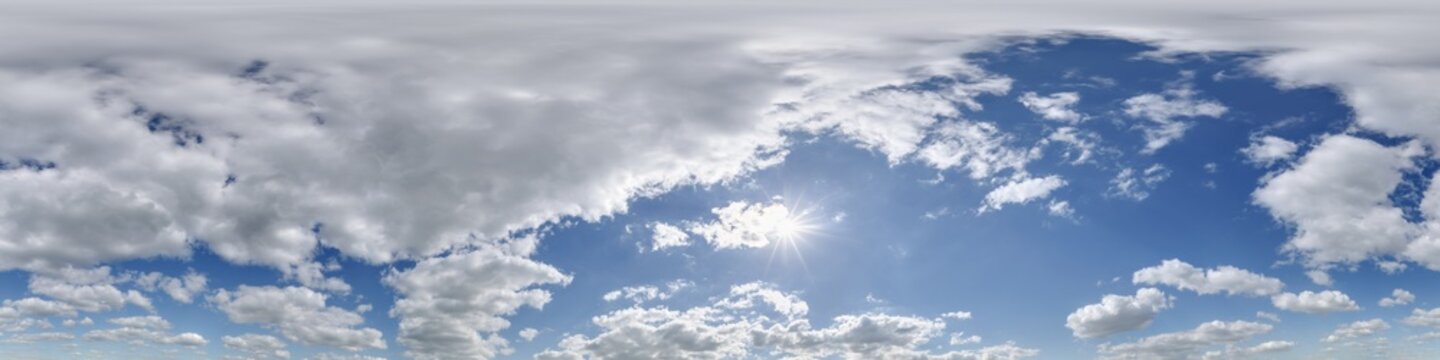 360 hdri blue sky with beautiful clouds with halo like a seamless panorama view with zenith for use in 3d graphics or game development as sky dome or edit drone shot